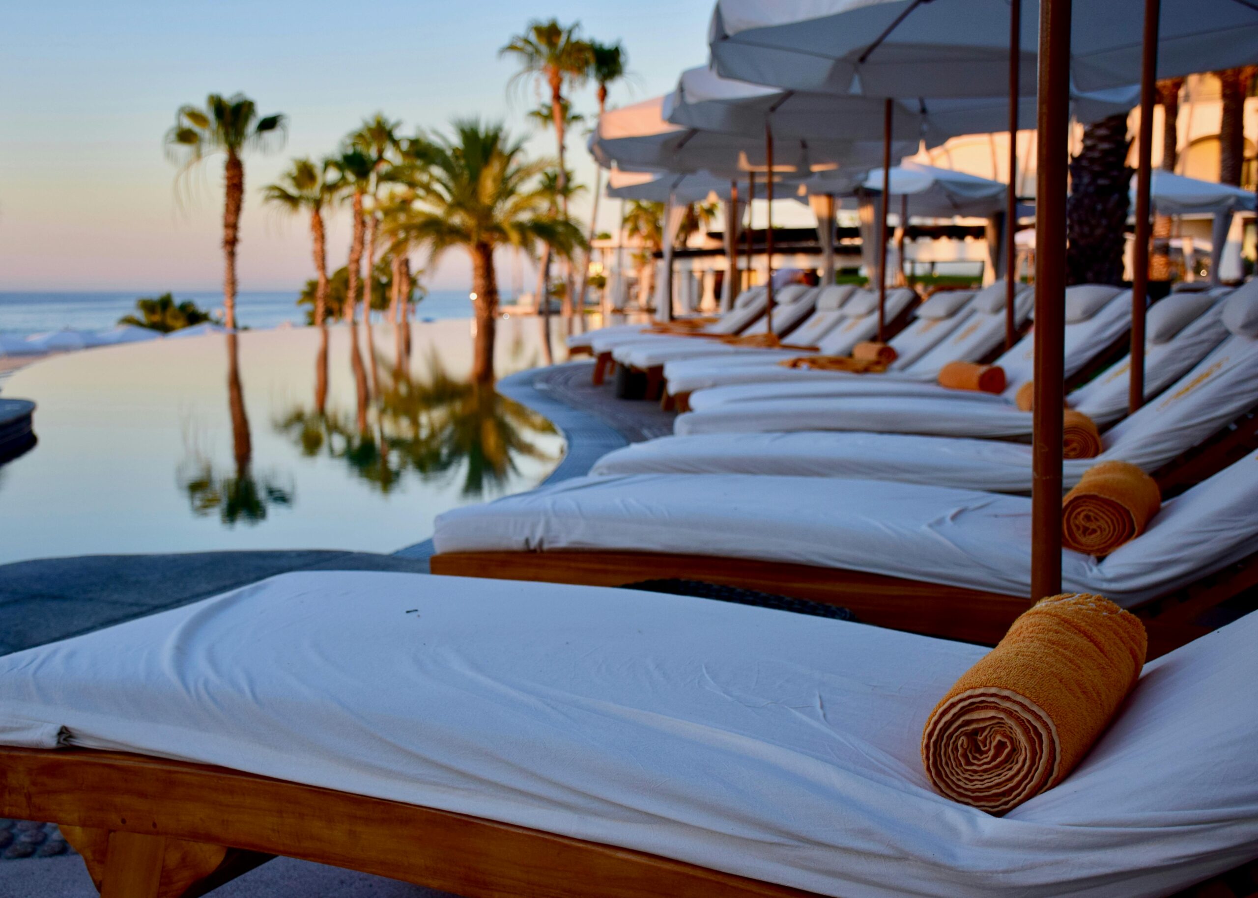 Experience luxury relaxation at a poolside resort in Cabo San Lucas, Mexico.